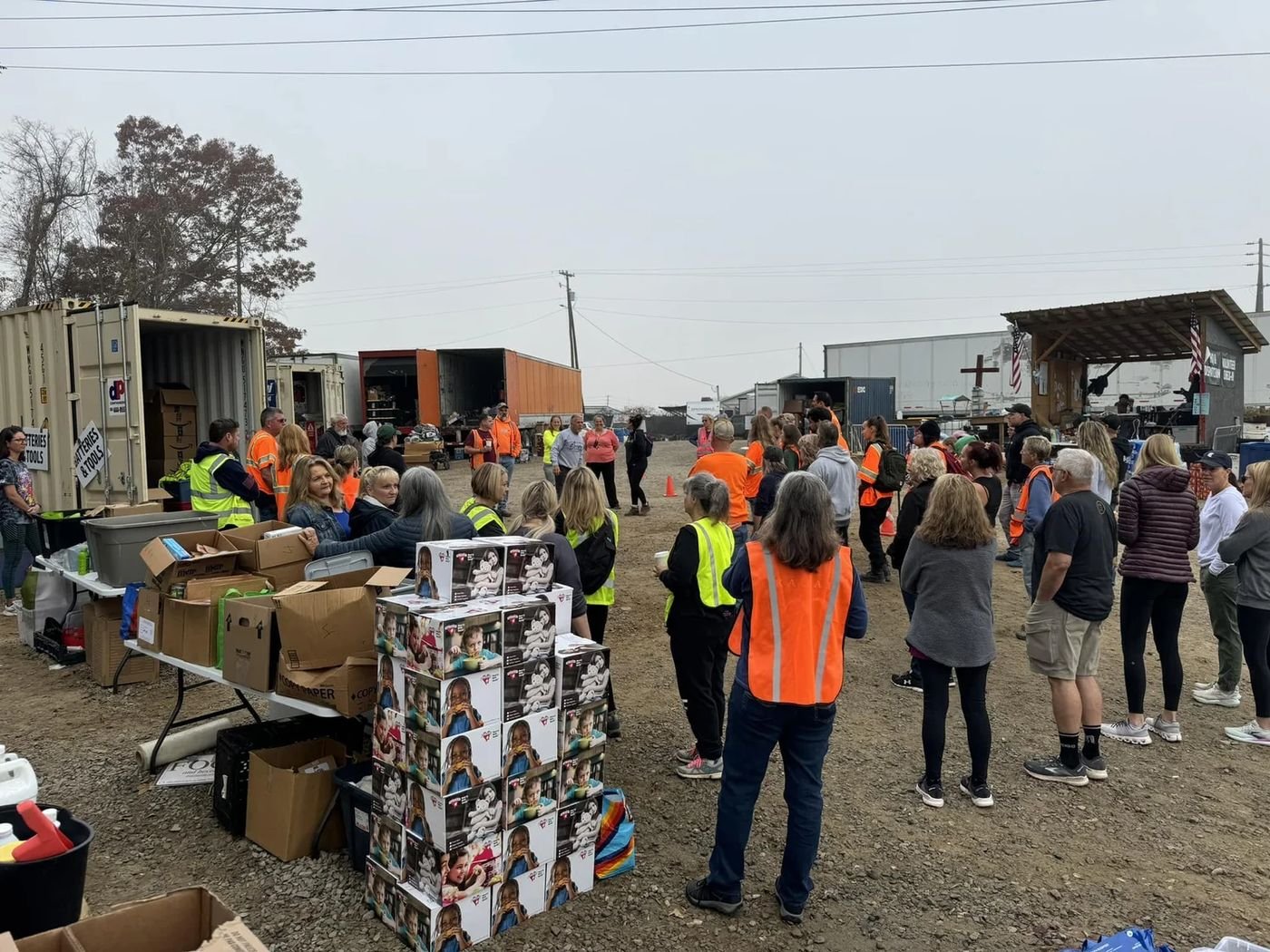 Volunteers gathered for a morning briefing at the distribution site