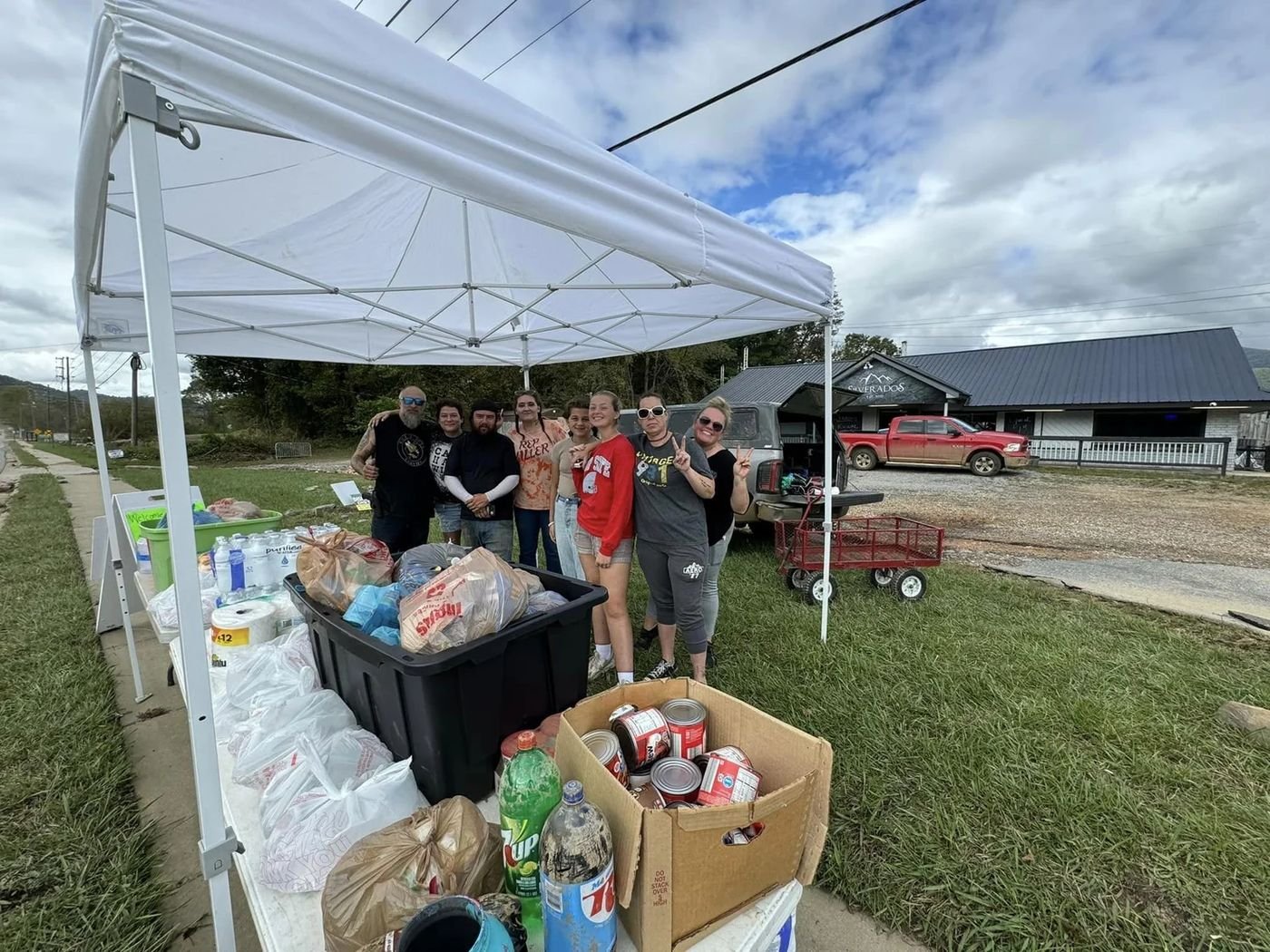 Volunteers under a supply tent in the first days after the storm